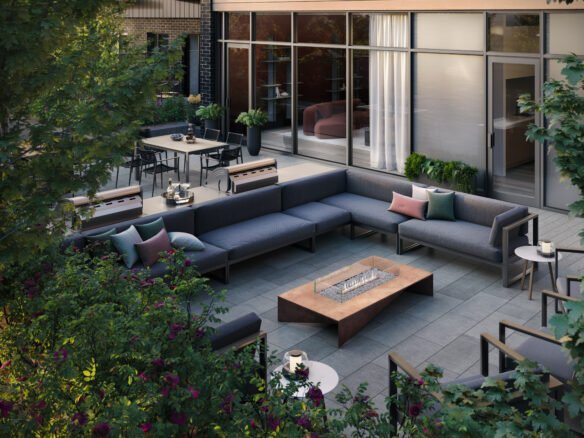 An outdoor patio with couches and a fire pit is perfect for those looking to enjoy the beautiful weather in their new homes.