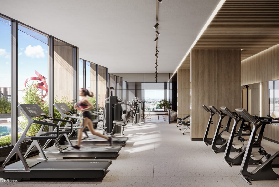 A gym with treadmills and elliptical machines.
