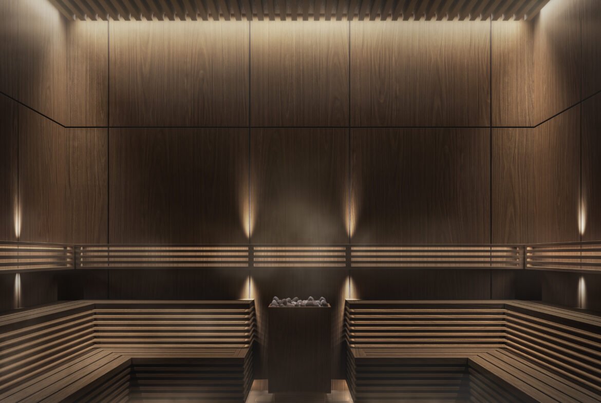 A sauna room with wooden benches and lighting in new homes in the GTA.