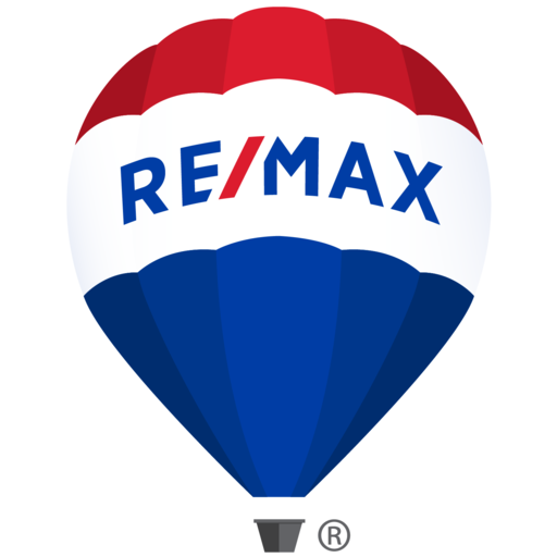 A red, white and blue hot air balloon with the word remax showcases new homes, pre construction homes.