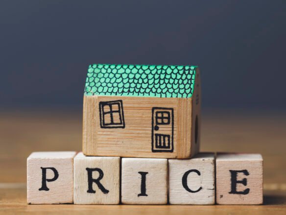 A wooden house with the words "New homes" written on it is for sale in Gta.