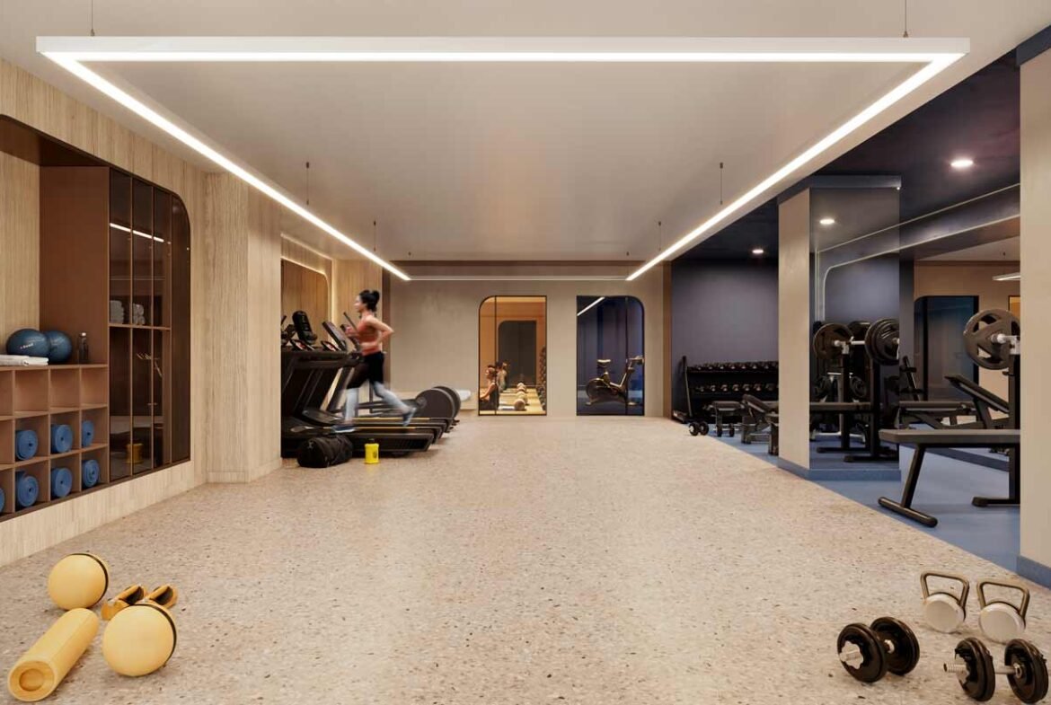 A gym room with dumbbells and weights in new condos in Gta.