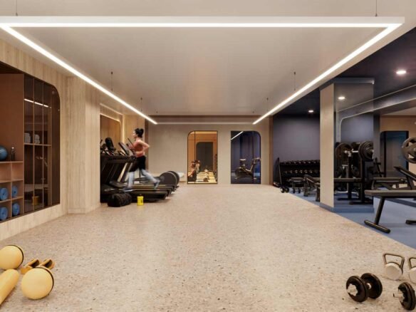 A gym room with dumbbells and weights in new condos in Gta.