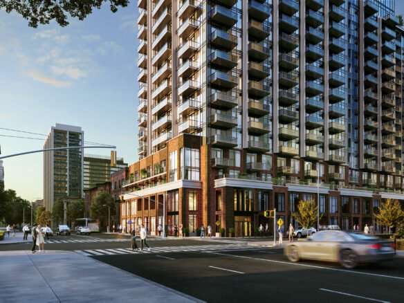 A modern, high-rise apartment building stands on a busy city street corner during the day. People are walking along the sidewalks, and cars are driving past. The building features many balconies and is surrounded by other tall structures and greenery, showcasing new condos in GTA.