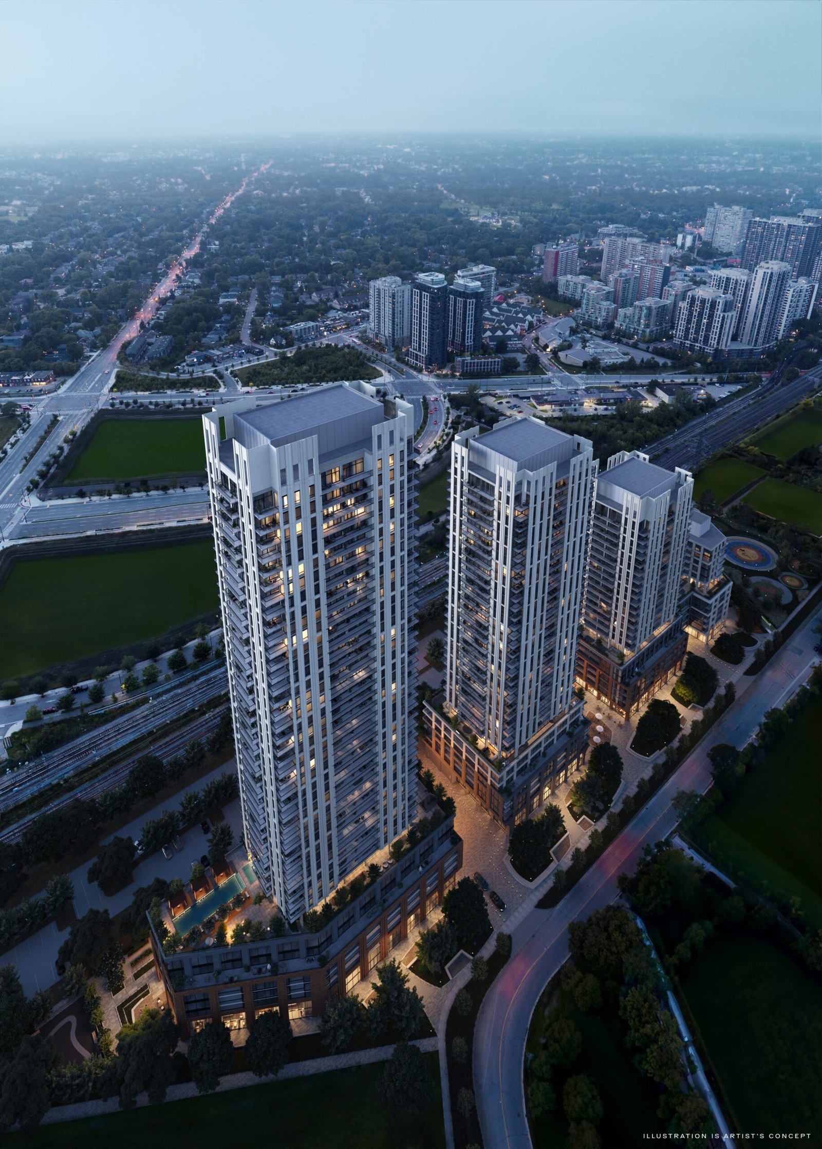 Aerial view of a modern residential high-rise complex during twilight, showcasing illuminated buildings and adjacent green spaces, with new condos in the background.