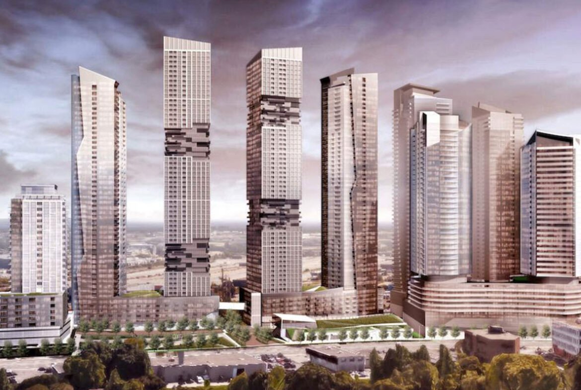 A digital rendering of a skyline featuring several tall, modern skyscrapers with unique designs. The buildings have a mix of glass and metal facades set against a cloudy sky. Green spaces and smaller structures are visible at the base, showcasing new homes in Toronto's urban landscape.