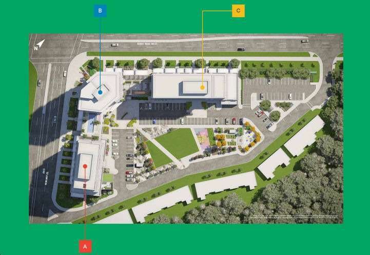 A top-down view of an urban development plan featuring new condos in GTA with marked locations in red, blue, and yellow. The site includes buildings, a parking lot, green spaces, pathways, and roads surrounding the area. Trees and greenery are visible around the development.