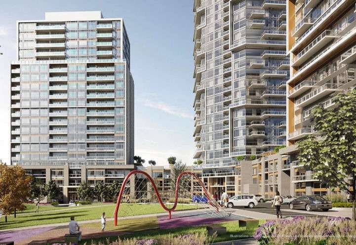 A modern residential complex featuring tall, multi-story buildings with glass facades. In the foreground, there's a grassy courtyard with a red abstract sculpture and a playground. People are walking and cars are parked nearby. Cloudy sky in the background highlights these new homes in GTA.