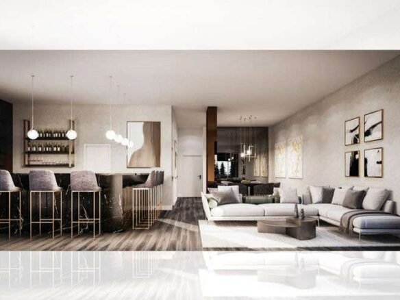 A modern open-concept living space in one of the new homes in GTA features a kitchen bar on the left with high stools and hanging lights. The right side has a cozy living area with a large sectional sofa, a coffee table, and wall art. The space is bright with a minimalist, elegant design.