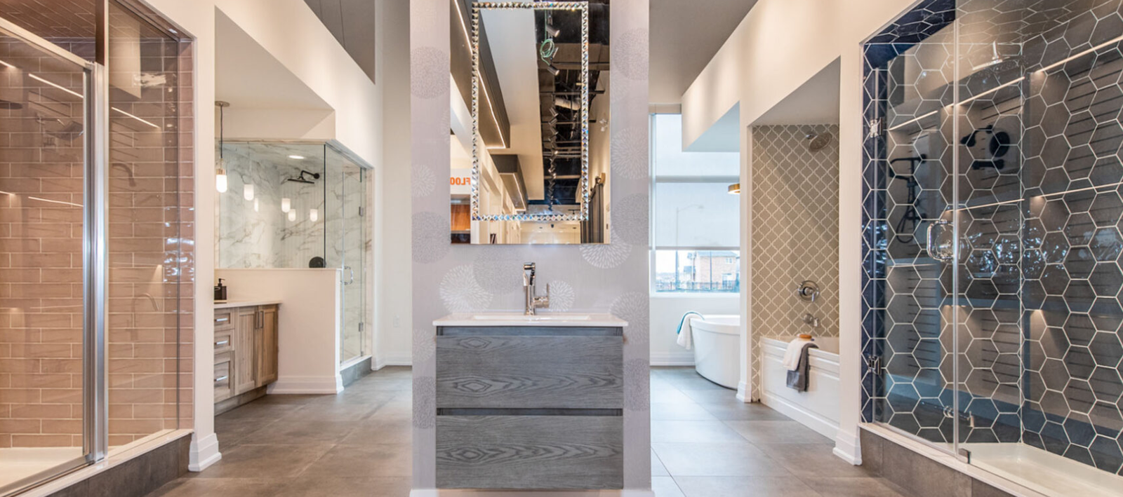 A stylish showroom display featuring modern bathroom designs, perfect for pre-construction homes. The centered vanity with a rectangular mirror is flanked by diverse shower and bathtub setups showcasing contemporary tiles, fixtures, and finishes. The overall look is sleek and sophisticated. A stylish showroom display featuring modern bathroom designs, perfect for pre-construction homes. The centered vanity with a rectangular mirror is flanked by diverse shower and bathtub setups showcasing contemporary tiles, fixtures, and finishes. The overall look is sleek and sophisticated.