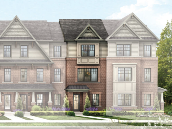 A three-story townhouse with a mix of brick and siding exterior. The building features multiple large windows, gabled roofs, and manicured landscaping with green lawns, small shrubs, and purple flowering plants. This exquisite residence is among the new homes in GTA's most sought-after neighborhoods.