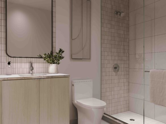 Modern bathroom in Sg Homes with soft pink walls, a wooden vanity with a rectangular mirror, a glass-enclosed shower, beige tiles, and subtle lighting.