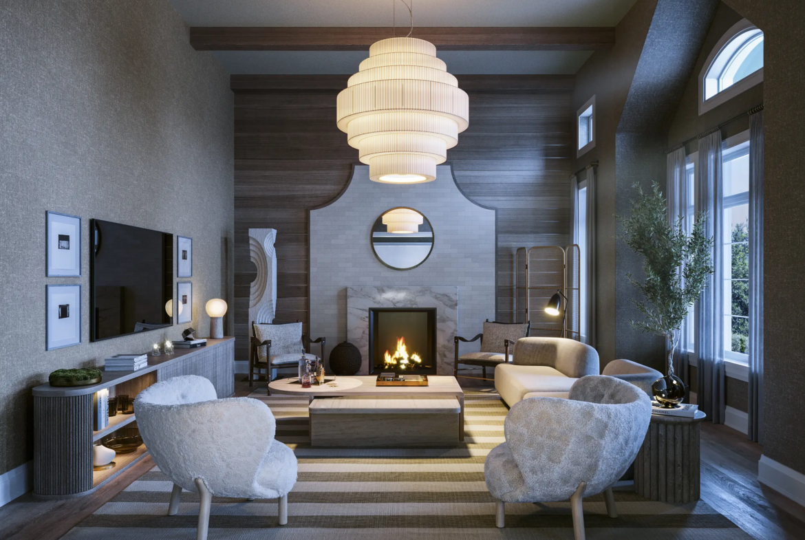 A cozy, modern living room in one of the new homes in GTA features a large central chandelier, three cushioned chairs, a round coffee table, and a striped rug. A fireplace with a large mirror above it is set against a wooden accent wall. Large windows bring in natural light, and potted plants add greenery.