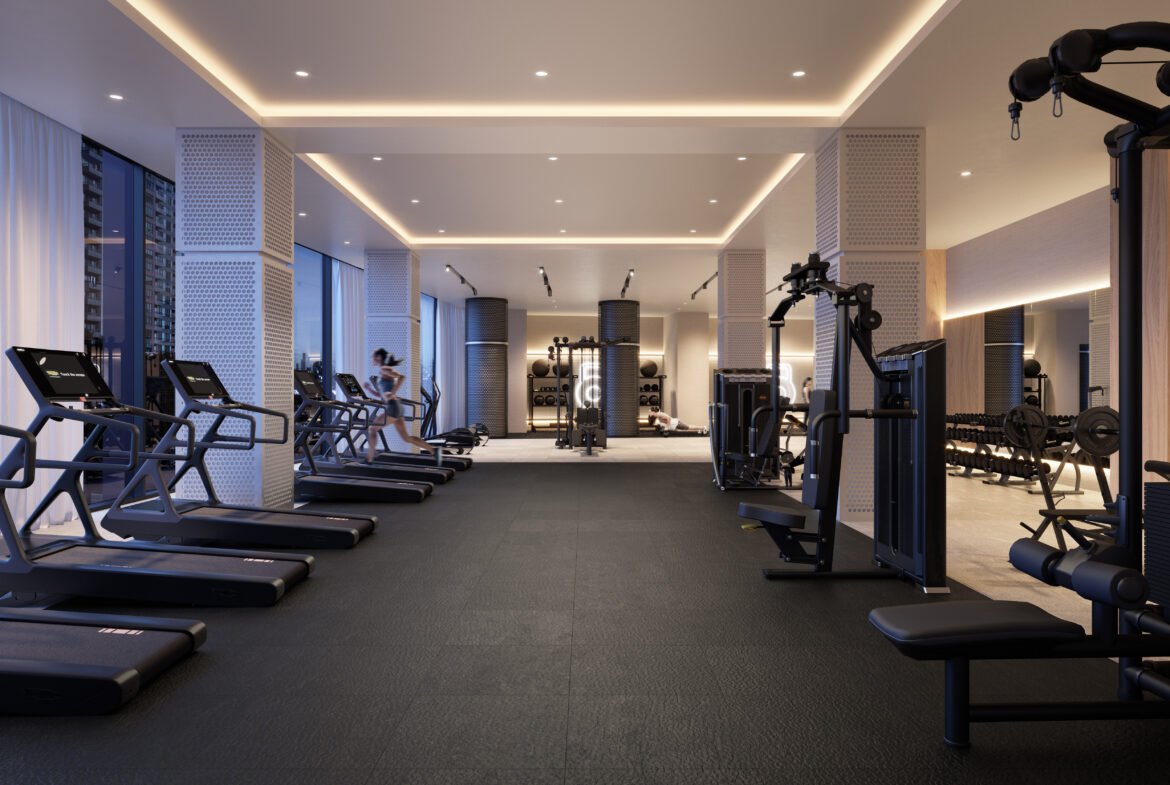Modern Sg Homes gym interior with treadmills, weights, and exercise equipment; featuring ambient lighting and clean design. One person visible, using equipment in the background.