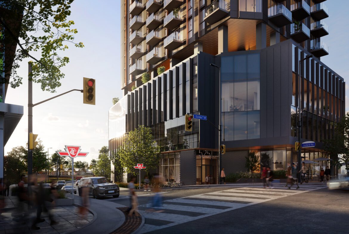 A vibrant street scene at dusk featuring a modern multi-story building with illuminated windows, pedestrians crossing the street, and blurred motion of cars. Trees line the sidewalk where signs for New Condos are visible.