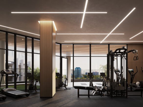 A gym room in a pre-construction building with a view of the city.