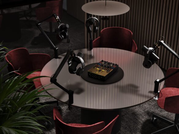 A modern podcast studio featuring a round table with microphones and headphones set up on boom arms, surrounded by luxurious red chairs, and ambient lighting. Also ideal for New homes in Gta promotions or discussions
