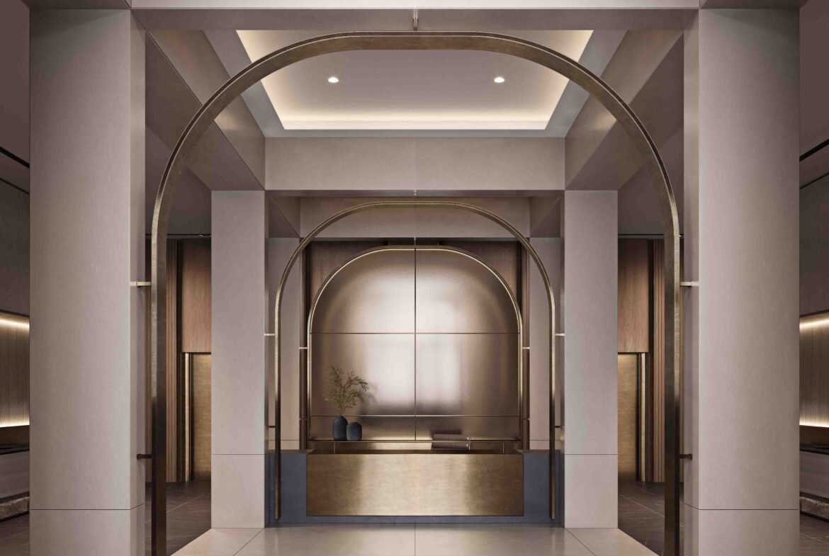 An artist's concept of pre-construction homes featuring a modern lobby with elegant archways, warm lighting, and a minimalist reception desk centered against a backdrop of potted plants and a decorative wall panel.