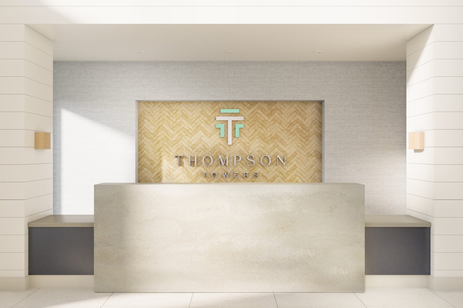 A modern reception desk with a light gray counter stands in front of a wall featuring a wood herringbone pattern. Above the desk, the text “THOMPSON TOWERS” is displayed alongside a stylized “TT” logo. The area, well-lit with neutral tones and minimalist design, highlights the appeal of new condos in GTA. A modern reception desk with a light gray counter stands in front of a wall featuring a wood herringbone pattern. Above the desk, the text "THOMPSON TOWERS" is displayed alongside a stylized "TT" logo. The area, well-lit with neutral tones and minimalist design, highlights the appeal of new condos in GTA.