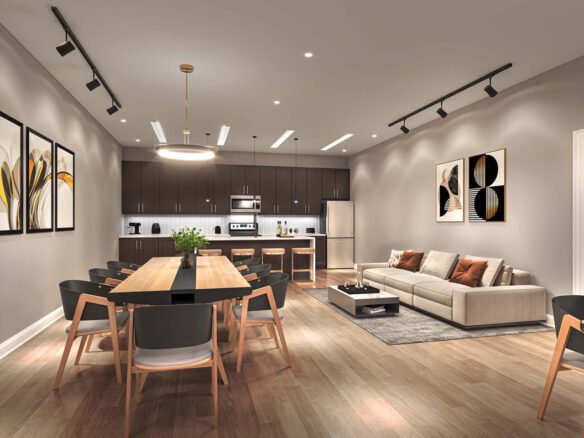 Modern open-plan living space featuring a kitchen with dark cabinetry, a dining area with a large wooden table, and a lounge with beige sofa, all under warm ambient lighting in New Condos