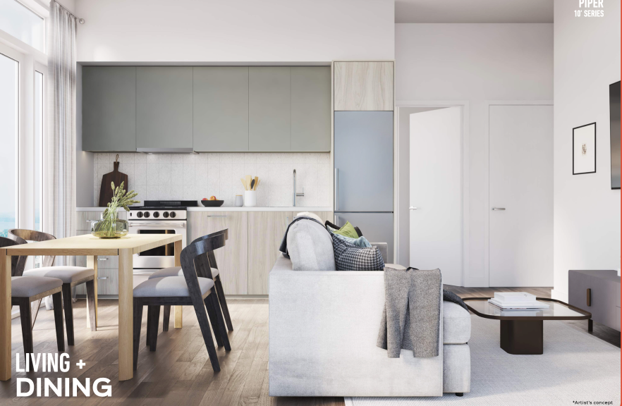 Modern living and dining area with an open-concept design in new homes. A wooden dining table with black chairs is situated near the compact kitchen, which features sleek cabinets and stainless steel appliances. A light gray sofa faces a wall-mounted TV. Contemporary decor adorns the space.