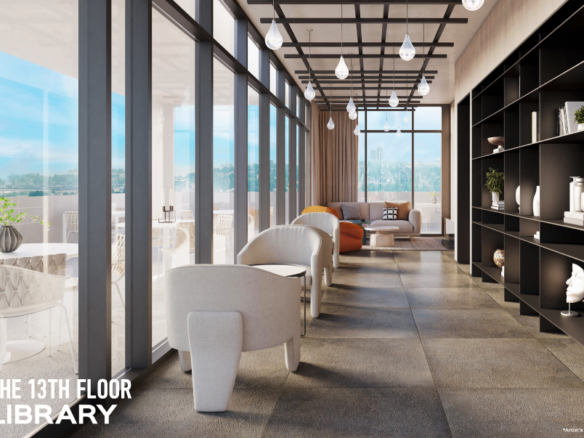 A modern library on the 13th floor of new condos in GTA features floor-to-ceiling windows with a city view. It has minimalist furniture, including white chairs and an orange sofa. Black shelving units display books and decorative items. Pendant lights hang from the ceiling.