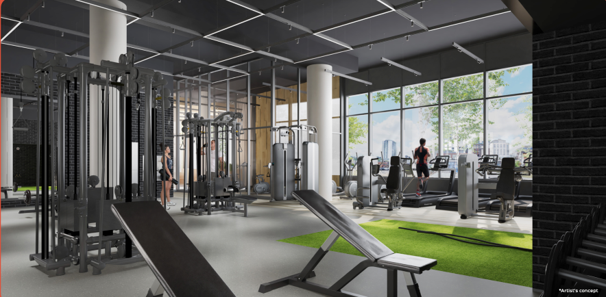 A modern gym with various exercise equipment, including weight machines, benches, and treadmills. Large windows provide a view of the cityscape and greenery outside, blending perfectly with the nearby new homes in GTA. People are using the equipment in this bright, clean space.