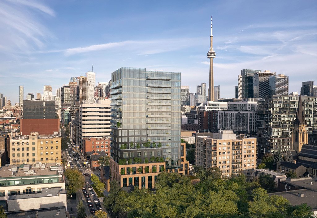 A city skyline blends modern high-rise buildings with historic architecture. The tallest tower commands attention, set against a clear blue sky. Green trees line the streets, adding natural beauty to the scene of new homes and development in Toronto's vibrant urban landscape.