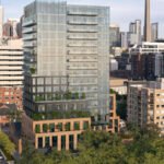 A view of a modern cityscape featuring various high-rise buildings. The central focus is on a tall glass building with balconies, surrounded by shorter office and residential structures. The streets below are lined with trees, adding greenery to the urban environment—an appealing sight for those seeking new condos in GTA.