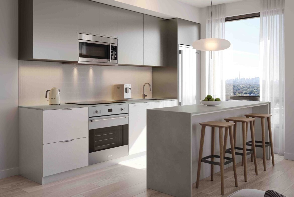 Modern kitchen in new condos with clean lines, featuring a white and gray color scheme, built-in appliances, an island with stools, and a large window with a city view.