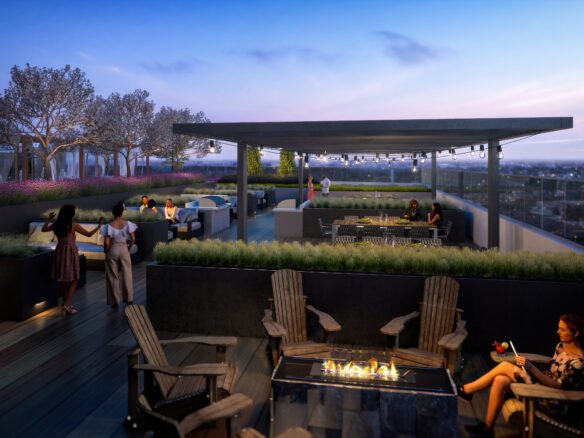 A rooftop terrace at dusk, featuring people socializing around a fire pit, sitting at tables, and enjoying the view of new condos in GTA. The space has modern furniture, plants, and string lights under a pergola, creating a cozy ambiance. Trees and a cityscape are visible in the background.