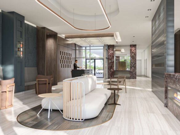 The modern hotel lobby boasts a sleek design with a white curved sofa and wooden chairs on a circular rug. To the right, a recessed fireplace adds warmth. The large window floods the space with light, complementing the reception desk in the background. Ideal inspiration for new condos in Brampton decor enthusiasts.
