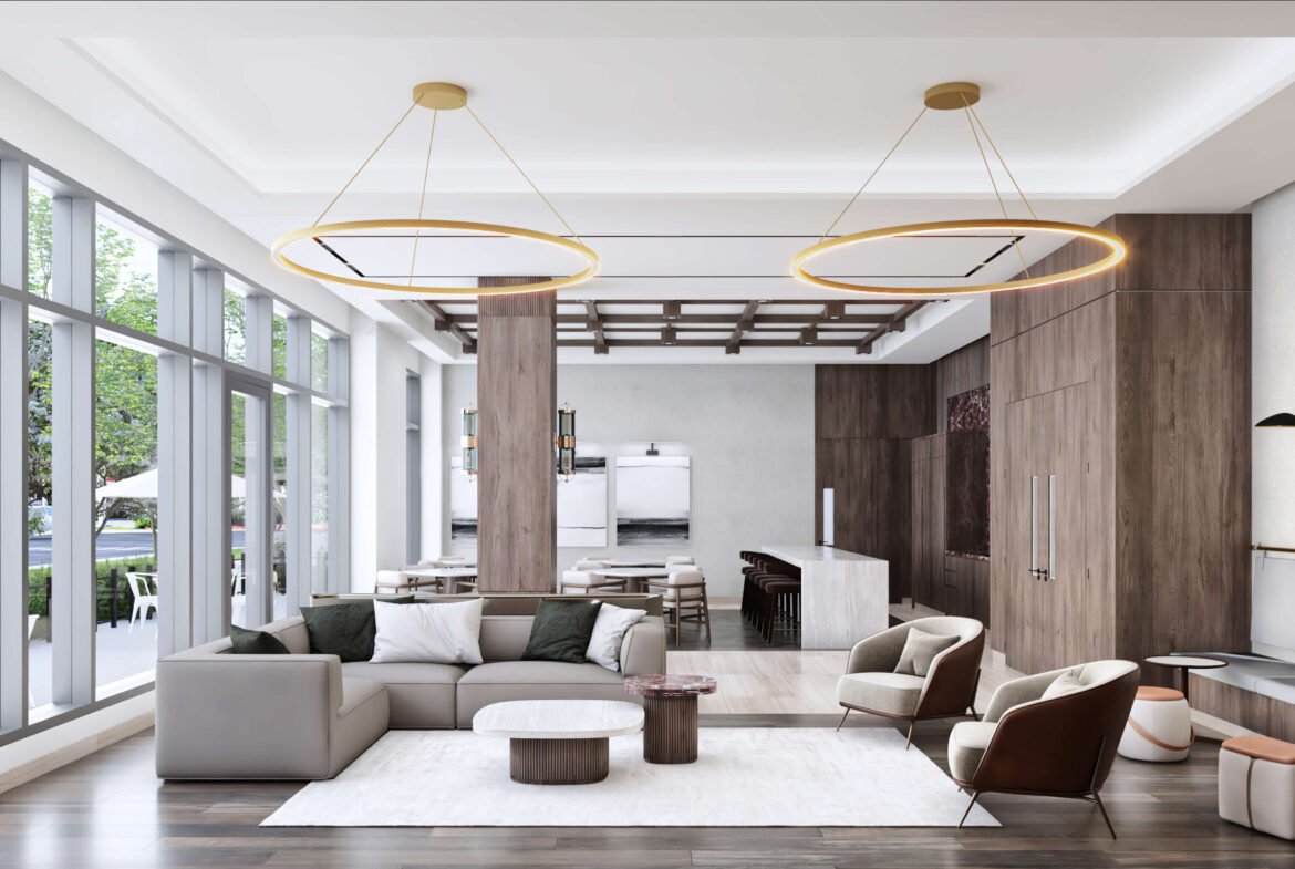 This modern living room showcases large windows, a gray sofa, armchairs, and wooden accents. Two circular chandeliers gracefully hang from the ceiling. The space features a soft rug and small tables, seamlessly blending contemporary design with natural elements—ideal for new condos in Toronto.