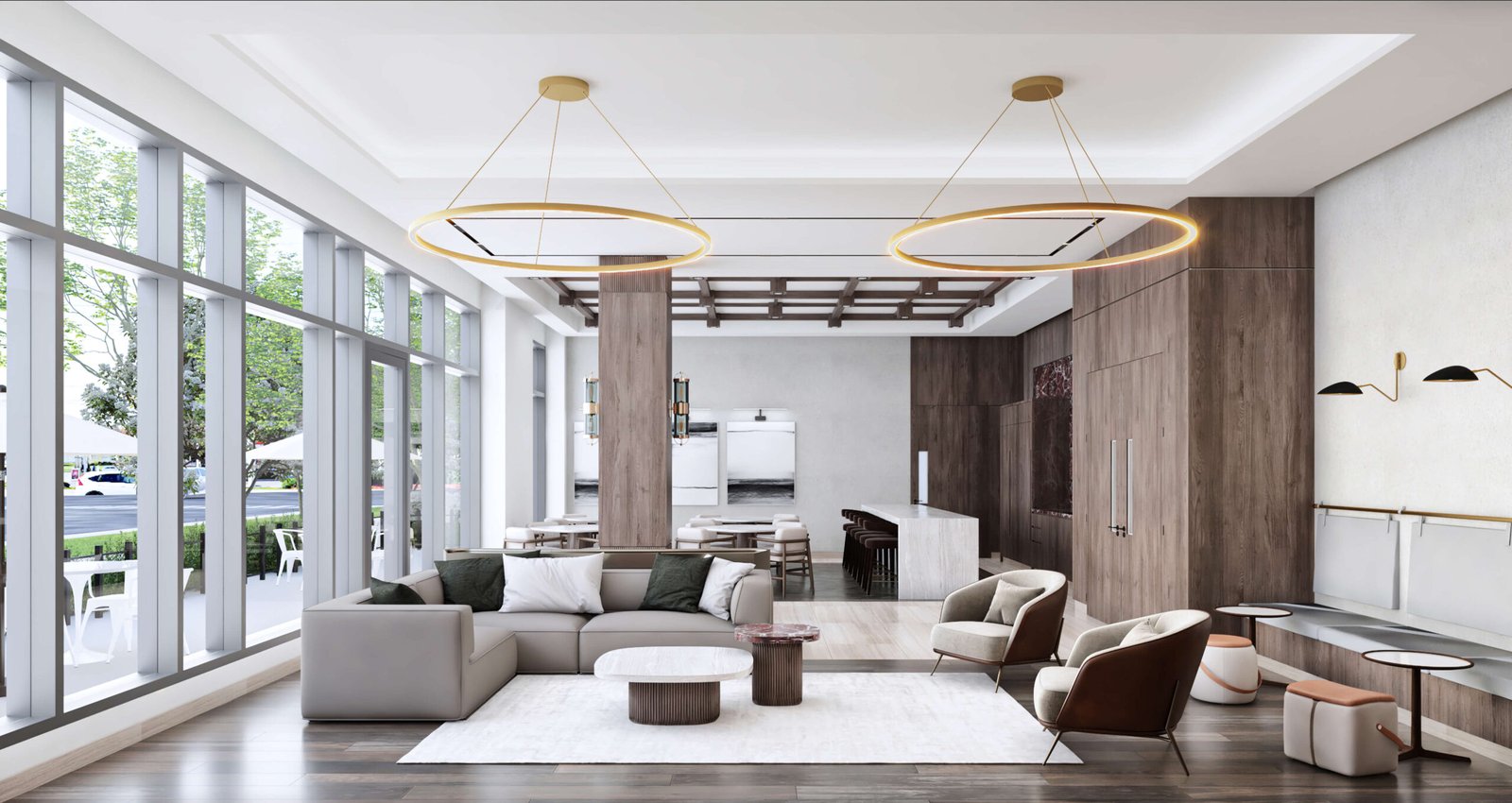 This modern living room showcases large windows, a gray sofa, armchairs, and wooden accents. Two circular chandeliers gracefully hang from the ceiling. The space features a soft rug and small tables, seamlessly blending contemporary design with natural elements—ideal for new condos in Toronto.