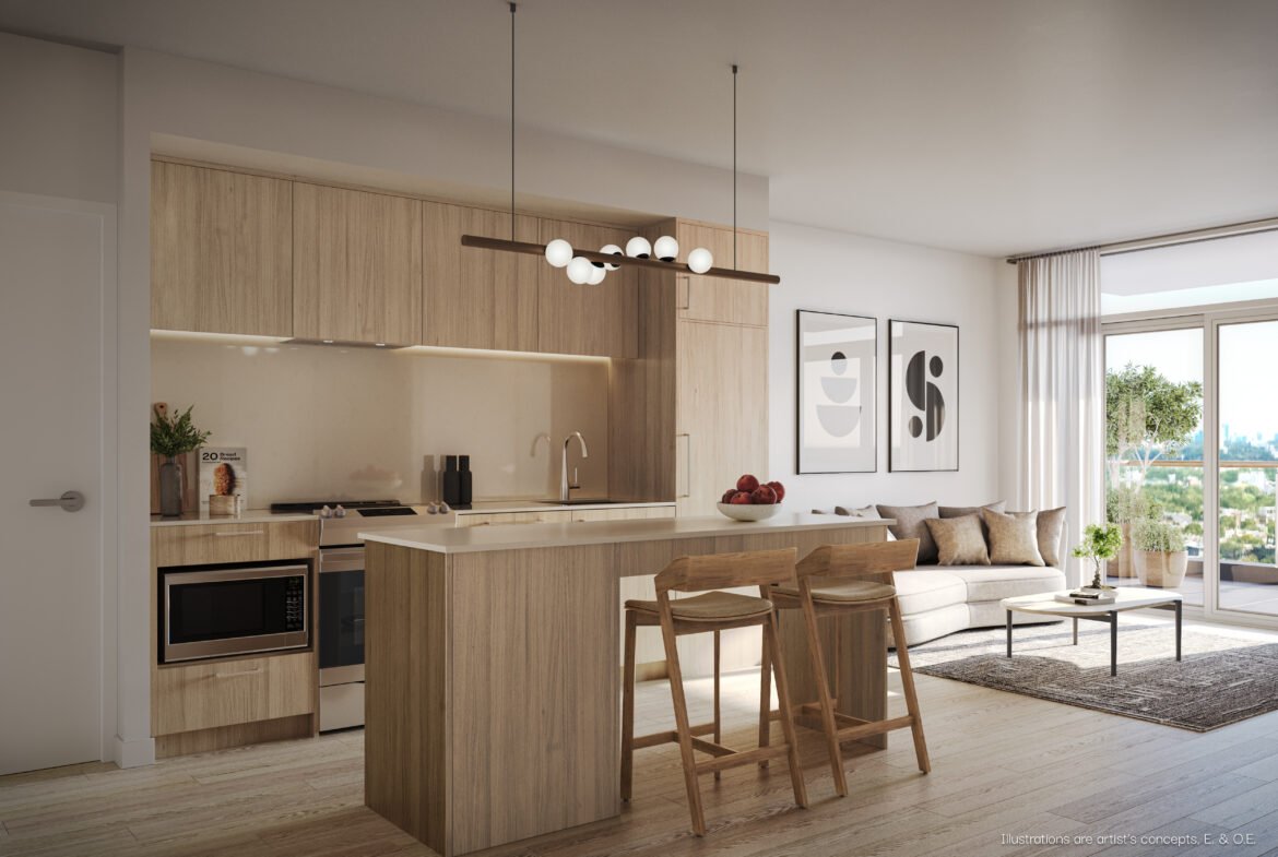 Modern open-plan kitchen and living area in New condos, featuring wooden cabinetry, an island with stools, integrated appliances, and a cozy sitting area with a sofa and wall art.