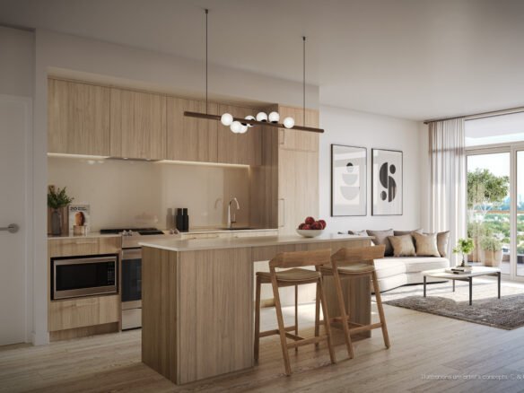 Modern open-plan kitchen and living area in New condos, featuring wooden cabinetry, an island with stools, integrated appliances, and a cozy sitting area with a sofa and wall art.