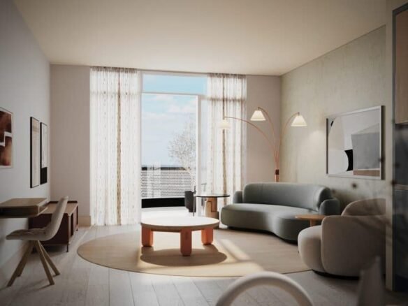 A modern living room featuring a light gray sofa, circular wooden coffee table, and matching armchair. The room has large windows with sheer curtains allowing natural light to flood in. A minimalistic floor lamp with three shades stands next to the sofa. Crosstown artwork decorates the walls.