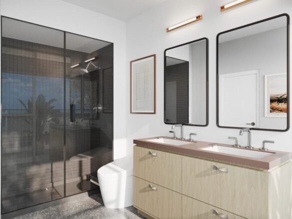 A modern bathroom in a pre-construction home features a double vanity with light wood cabinets and rectangular mirrors, a glass shower enclosure, and a toilet. Artwork hangs on the walls, and a window