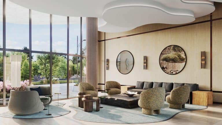 A modern living room in New Condos with large windows overlooking greenery, featuring a gray sectional sofa, blue armchairs, unique stone coffee tables, and stylish wood paneling with circular art pieces