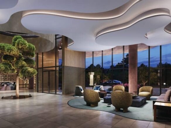 Modern hotel lobby at dusk featuring sculptural white ceiling, stylish furniture, and floor-to-ceiling windows showing outdoor views.