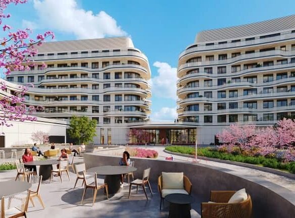 A digital rendering of modern courtyard with curved residential buildings showcases new condos and SG Homes. People sit at tables under blossoming pink cherry trees, enjoying the sunny outdoor setting.