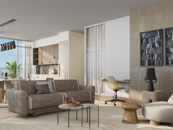 Modern living room in pre construction homes with a textured wall, couch, armchairs, coffee table, and a view of the sea through large windows. Bright, airy space with tasteful decorations and