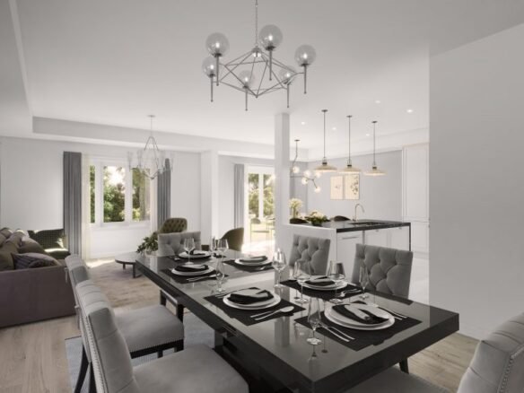 A modern open-plan dining and living area in one of the elegant new homes features a sleek black dining table set for six. The space boasts a contemporary chandelier, light gray walls, large windows, and a view of the kitchen with an island and pendant lights in the background.