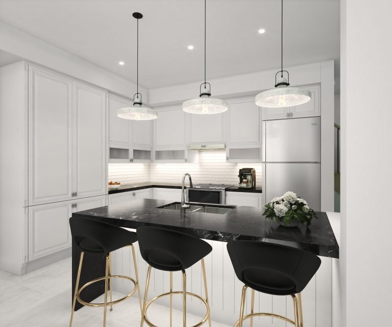 A modern kitchen in a pre-construction home features white cabinets, a black marble island, and three pendant lights. The island boasts three black stools with gold accents. A stainless steel fridge and a potted plant complete the elegant space.