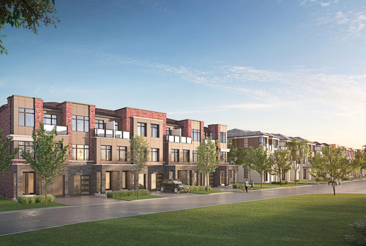 A row of modern, red-brick townhouses lines a tree-lined street. The new homes feature large windows and balconies. Two people walk along the sidewalk, and a car is parked in a driveway. The sky is clear and blue, suggesting it's a sunny day.