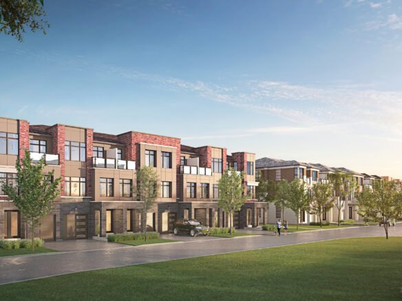 A row of modern, red-brick townhouses lines a tree-lined street. The new homes feature large windows and balconies. Two people walk along the sidewalk, and a car is parked in a driveway. The sky is clear and blue, suggesting it's a sunny day.