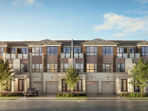 A modern three-story townhouse complex with a brick and siding exterior showcases large windows and balconies. Trees gracefully line the street, while a parked car rests in front. The sky is clear and blue, complementing these new homes in Brampton's serene setting.