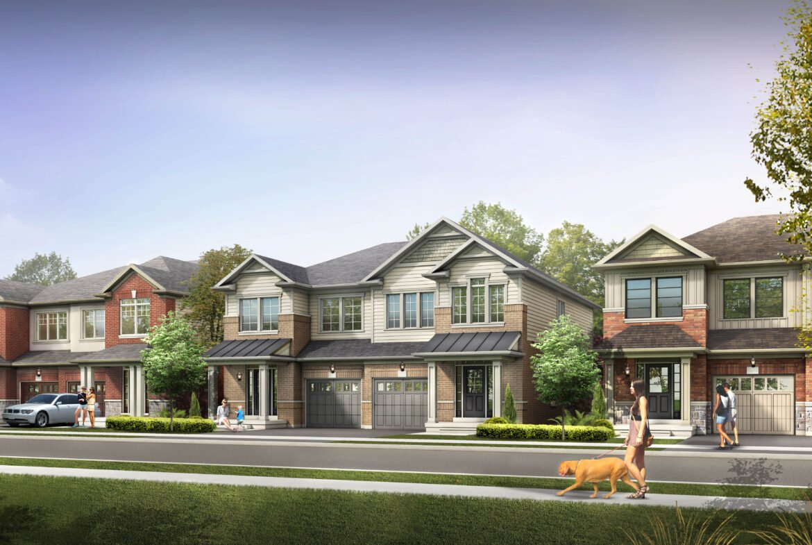 A row of suburban houses with varying architectural styles lines a tree-filled street. People stroll the sidewalk, and a dog is being walked. Cars are parked in driveways and on the street under a clear blue sky, complementing the new homes in Brampton.