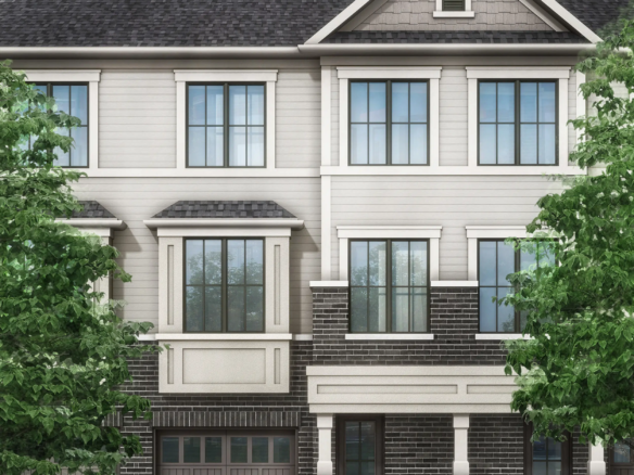 Image of a modern three-story townhouse with a gray and beige facade, large windows, and two garages. Flanked by vibrant green trees under a clear sky with scattered clouds, this residence epitomizes the charm of new homes in Brampton.