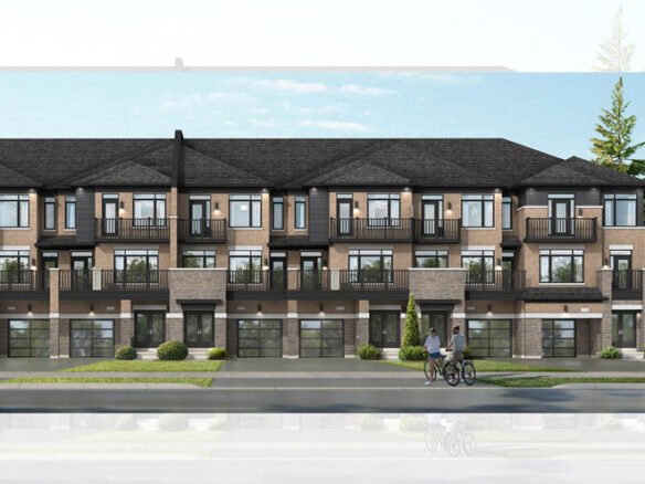 A modern townhouse complex with stylish two-story buildings features dark roofs and numerous balconies. The facade blends brick and glass elements. Two people ride bicycles on the pavement in front, while trees and a clear sky grace the background, highlighting the allure of new homes in Brampton.
